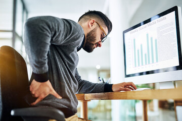 Poster - Back pain, business man and office desk with strain, stress and anxiety by a computer with web graph. Tech, screen and chart with online, digital and social media report with work problem at company