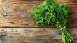 Fresh dill on rustic wooden background