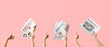 © Pixel-Shot - Women with newspapers showing thumbs-up on pink background
