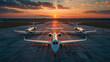 © khonkangrua - A dramatic scene with several private jets lined up on a runway during a picturesque sunset.