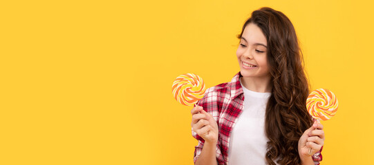 Poster - hipster kid with long curly hair hold lollypop. sugar candy on stick. caramel candy shop. Teenager child with sweets, poster banner header, copy space.