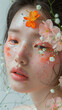 creative makeup idea. female face model with peach flower makeup look