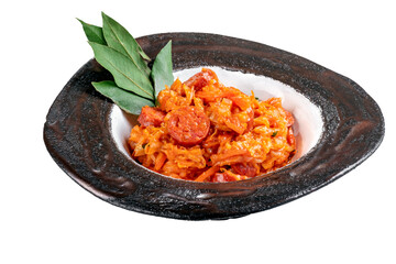 Wall Mural - Stewed cabbage in German Traditional homemade sauerkraut stew with smoked sausages in a plate isolated on a white background, close up