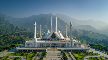 Wall Mural - Aerial view of the Faisal Mosque in Islamabad, Pakistan, featuring its modern design with white minarets and tent-like structure set against the Margalla Hills.     