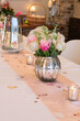 Elegant wedding table with pink roses and soft candlelight