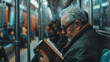 © AnniePatt - A crowded subway. in person wearing glasses is reading a book. The scenery outside the window is visible, with everything except the person reading the book being out of focus.