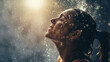 © Лариса Лазебная - A striking shot of a woman pouring water over her head to cool down after a vigorous workout, the droplets catching the light as they cascade down her face and neck. Dynamic and dr