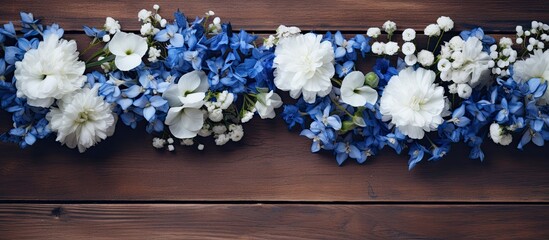 Aufkleber - A visually striking arrangement of blue and white flowers on a wooden background captured from an overhead perspective with empty space for additional content