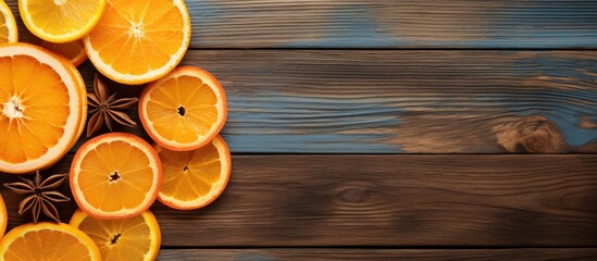 Sticker - Top view of orange chips and dried orange slices arranged on a wooden background The horizontal copy space image showcases the vibrant colors of the citrus fruit in a visually appealing flat lay comp