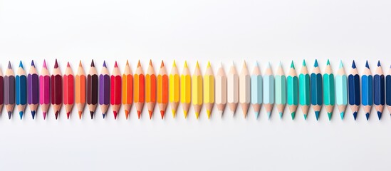 Aufkleber - A copy space image showing organized colored pencil tips on a white surface viewed from above
