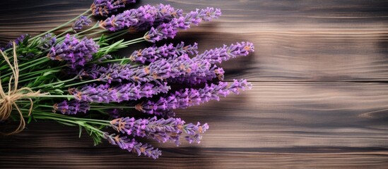 Sticker - A top down view of fresh lavender bouquet with wood as the background creates a captivating copy space image