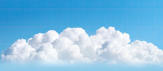 Sticker - A serene image of a fluffy white cloud against a vivid blue sky offering ample copy space