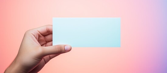 Aufkleber - A hand holds a blank card with a pastel background providing a space for copying images. Creative banner. Copyspace image