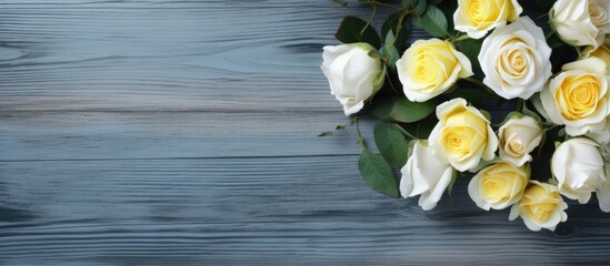 Poster - A white and yellow rose arrangement is beautifully displayed on a rustic blue wooden background creating a perfect copy space image for a message on a blank white card