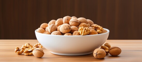 Wall Mural - A bowl containing a mixture of walnuts and peanuts with plenty of space for a copy space image