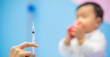 © BESTIMAGE - pediatrician Hand hold vaccine liquid injection in syringe for injecting child baby infant. small syringe needle for infant prevention flu by vaccination immunity in Pediatrics hospital clinic.