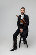 Elegant violinist with instrument at concert