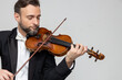 Bearded musician performed violin at classical music concert