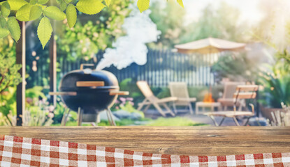 Wall Mural - summer time party in backyard garden with grill BBQ, wooden table, blurred background