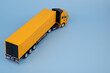 Yellow cargo truck on blue background with copy space for text. Cargo and transport concept.