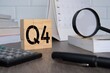 © izzuan - Close up image of wooden cubes with alphabet Q4 on office desk. Fourth quarter concept.