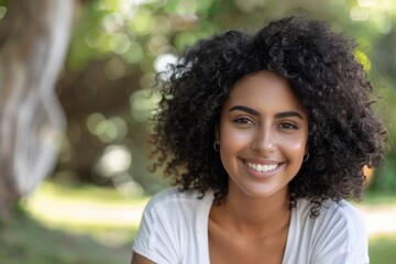 Wall Mural - Woman Smiling Outside. Close-up of Beautiful Hispanic Woman Enjoying Outdoors