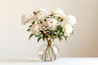 Bouquet of white peonies in a vase on a white background