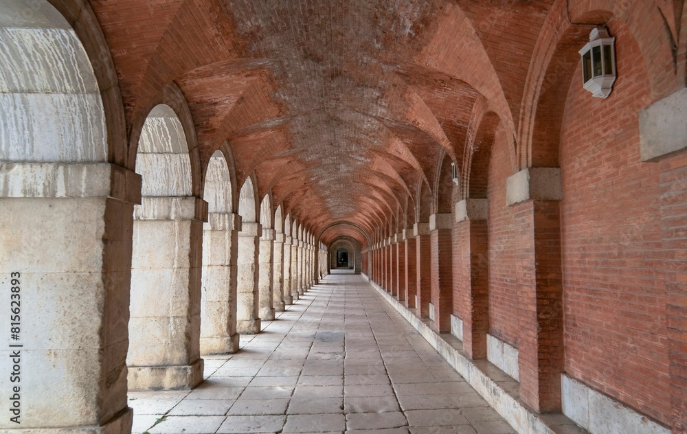 Symmetrical corridor with arches and columns in the royal palace of ...