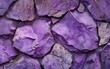 Close-up of purple painted rocks with a textured finish and subtle color variations.