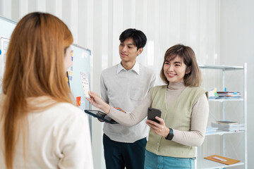 Wall Mural - ui designer and ux developer brainstorm idea to design the application appearance in the early stage