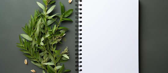 Aufkleber - A notebook with a white page and copy space image adorned with curry leaves