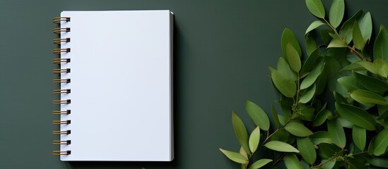 Aufkleber - A notebook with a white page and copy space image adorned with curry leaves