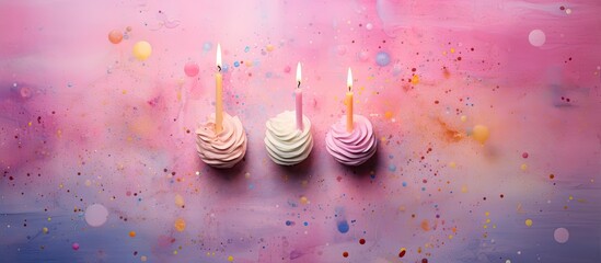 Poster - Three small pink wax decorative candles on a colored watercolor background Composition for a birthday or a party Flat lay top view copy space