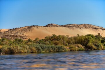 Wall Mural - Beautiful dunes in the desert of the Aswan Valley located on the banks of the Nile River in Egypt.