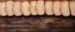 Sliced bread on wooden table Top view with space for text or recipe. copy space available