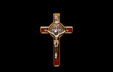 Fototapeta  - A close up of a metal crucifix on a black background