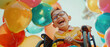 © Ai Studio - Joyful child in glasses laughs among a sea of colorful balloons, wheelchair-bound.