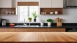 © Oleks Stock - Wood table top on blur kitchen counter (room)background.