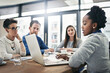 © peopleimages.com - Company, discussion and business people with laptop in office for strategy, meeting and brainstorming. Employees, collaboration and review with paperwork for financial investment, report and planning