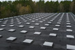 © Natalia Prasm - Top view of a modern roof with natural light. Skylights. Energy efficiency. Transparent panels on the roof.