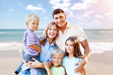 Canvas Print - Happy family with children having fun on the beach