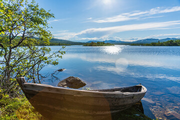 summer view across a lake in the vast highlands in northern sweden