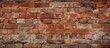© StockKing - The image shows a close up view of a textured red brick wall creating a full background view with copy space
