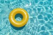 Yellow float on a swimming pool on a sunny summer day. Graphic resource for summer