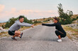 A Romantic Couple Stretching Down After a Run