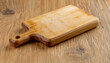 Cutting board on the wooden background