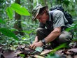 A researcher carefully examines andJi Lu s data about the soil in a lush, biodiverse rainforest.