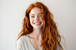 © igorfrost - portrait of young redhead woman with freckles, smiling. girl with long red wavy hair looking happy and radiant. ginger female on white background, isolated with copy space