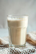Coffee latte in a glass on a light background.