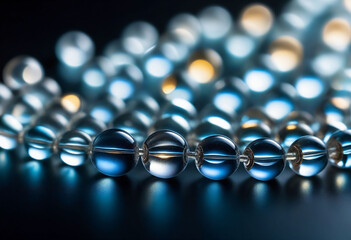 Wall Mural - A close-up image of small, round, transparent beads with a shiny surface reflecting the light